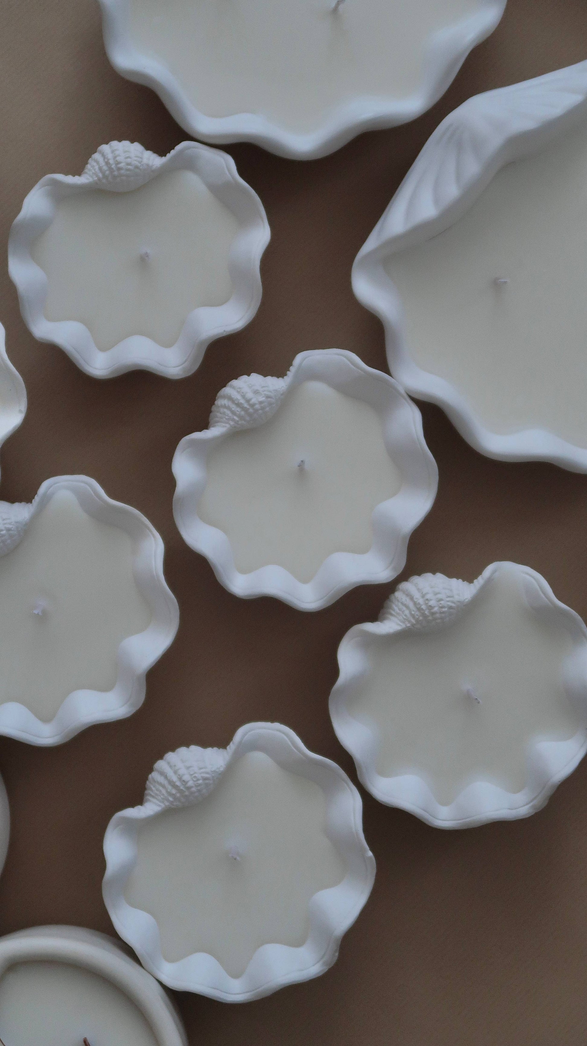Elevate your ambiance with a Mini Clamshell Candle. Crafted with cruelty-free scents and coconut wax, each candle is meticulously hand-poured to order, ensuring a unique experience for every customer. Each jar is individually hand poured.  

