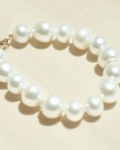 This striking Pearl Strand Bracelet features fifteen (15) 12 to 14mm mix shaped A2+ to B1+ grade Cygnet Bay (WA) grown Australian South Sea pearls. This 18cm pearl strand is set with a 9ct Yellow Gold clasp.