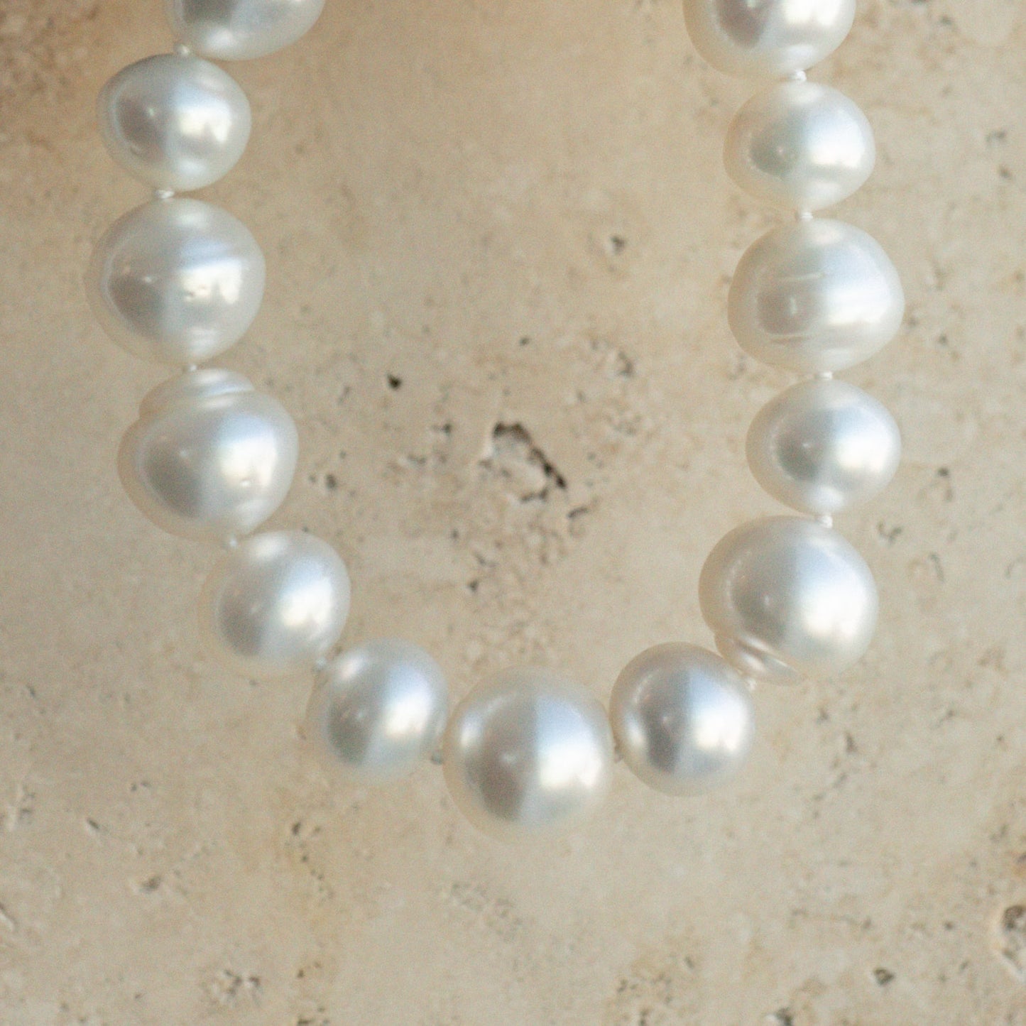 This striking Pearl Strand Bracelet features fifteen (15) 12 to 14mm mix shaped A2+ to B1+ grade Cygnet Bay (WA) grown Australian South Sea pearls. This 18cm pearl strand is set with a 9ct Yellow Gold clasp.