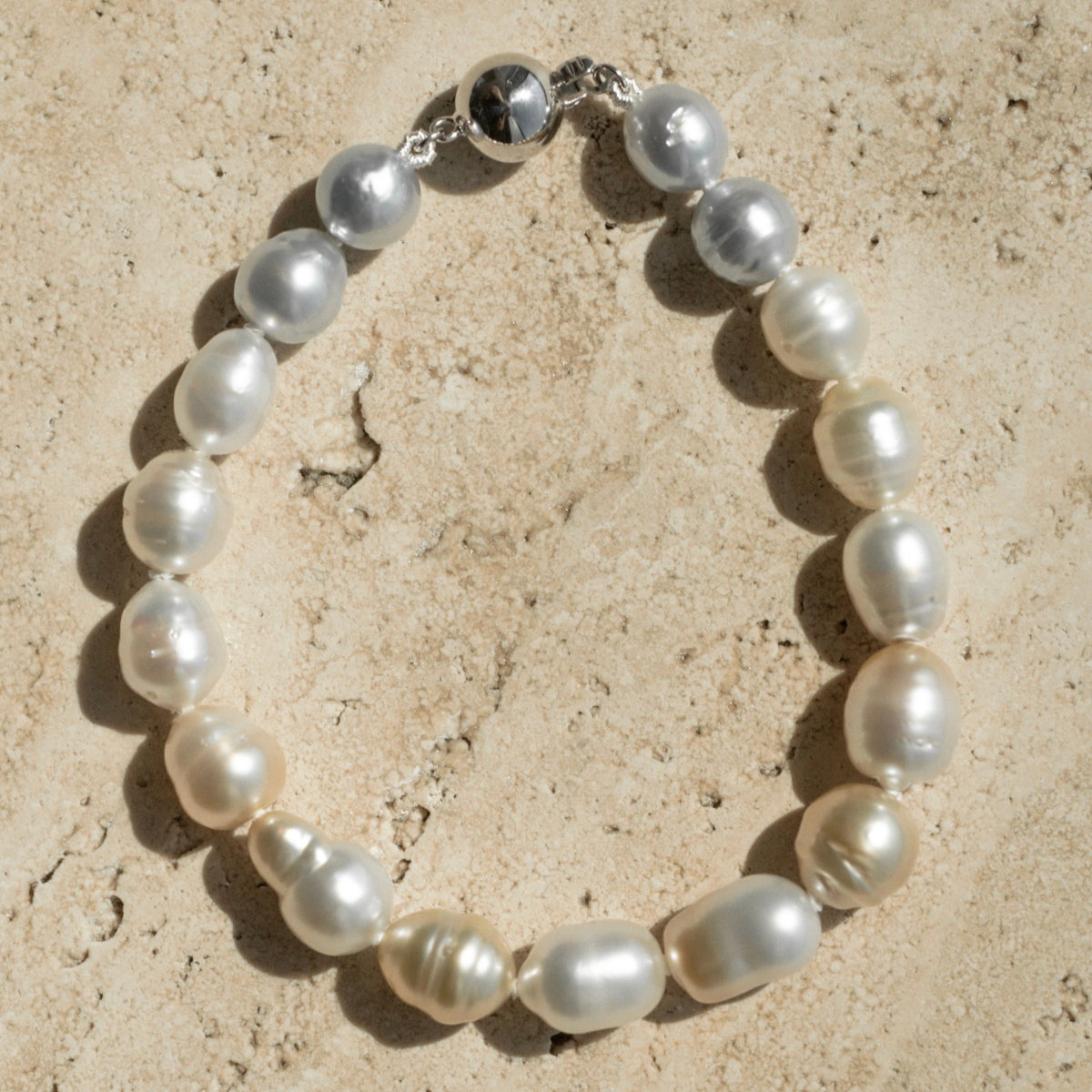 This striking Pearl Strand Bracelet features seventeen (17) 7mm to 8.5mm, Mix Colour A3 to B2 grade Cygnet Bay (WA) grown Australian South Sea pearls. This 17cm pearl strand is set with an 18ct White Gold clasp.