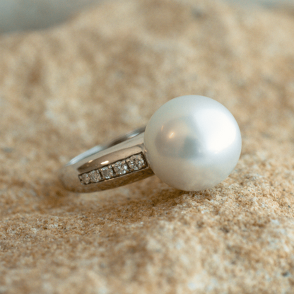 A classic Mojo Diamond Pearl Ring features a Cygnet Bay (WA) grown Australian South Sea pearl set alongside a band of White Diamonds.