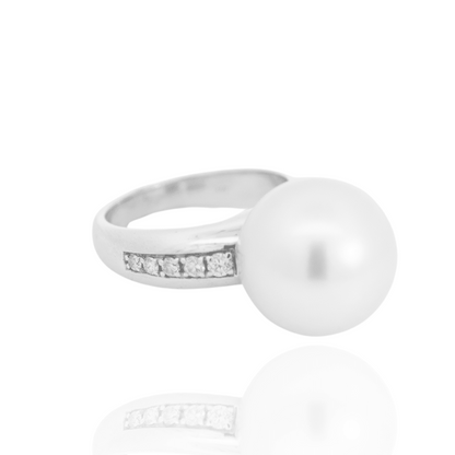 A classic Mojo Diamond Pearl Ring features a Cygnet Bay (WA) grown Australian South Sea pearl set alongside a band of White Diamonds.