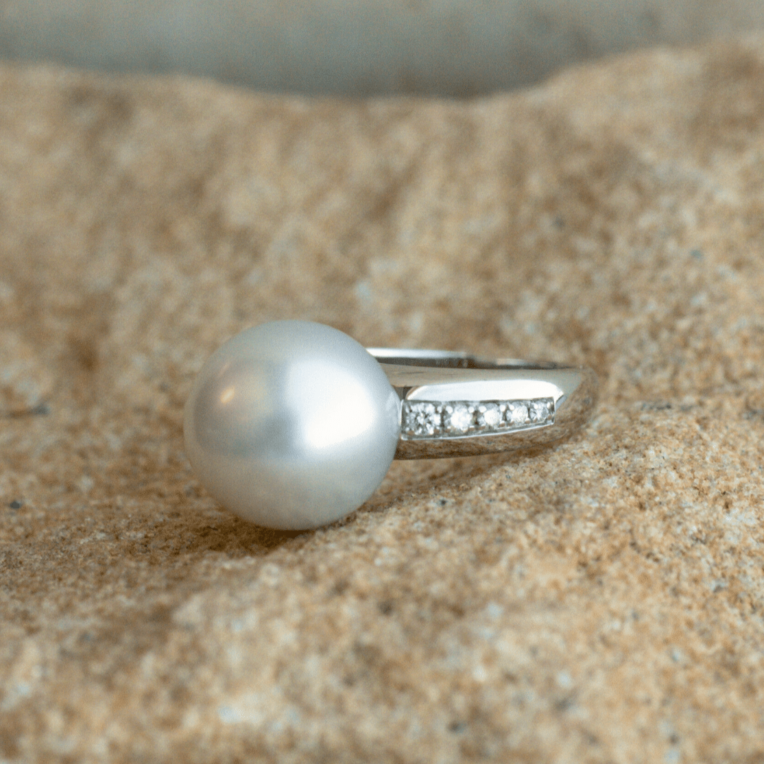 A classic Mojo Diamond Pearl Ring features a Cygnet Bay (WA) grown Australian South Sea pearl set alongside a band of White Diamonds.