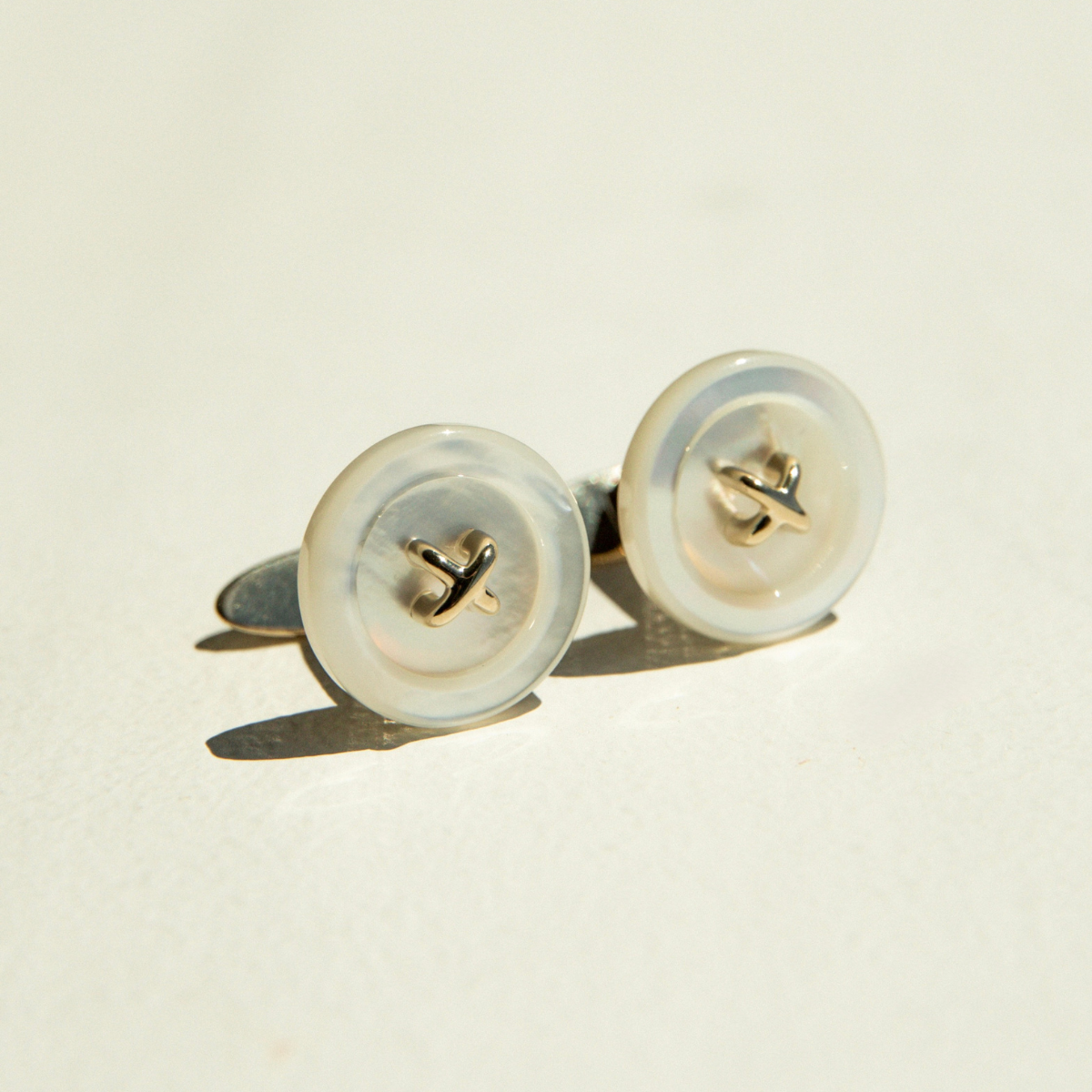 Pair of Mother of Pearl and gold cufflinks.