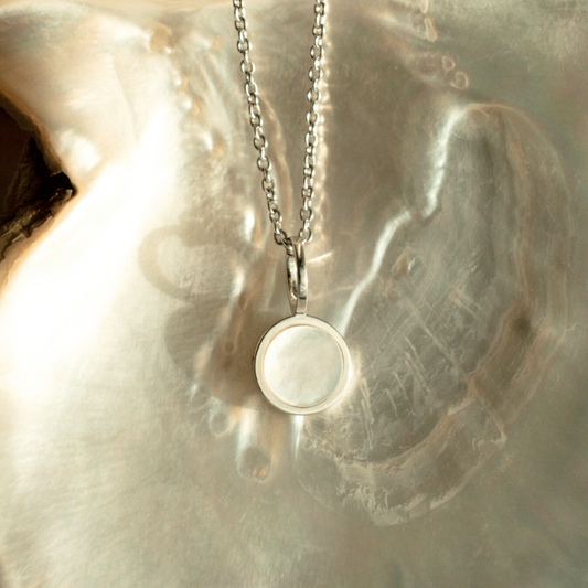 The timeless My Planet Charm features our Cygnet Bay (WA) Australian South Sea Mother of Pearl shell set in Sterling Silver.