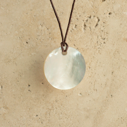 Our stunning Mother of Pearl Nacre Necklace features our Cygnet Bay grown Mother of Pearl shell carved into a circle shape, strung on a leather cord.