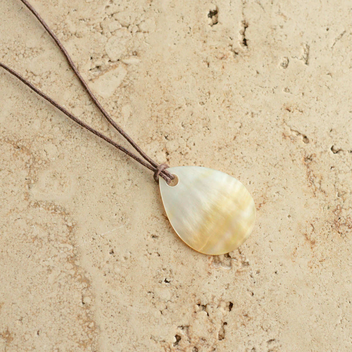 Our stunning Mother of Pearl Nacre Necklaces feature our Cygnet Bay grown Mother of Pearl shell carved into a tear drop shape, strung on a leather cord.