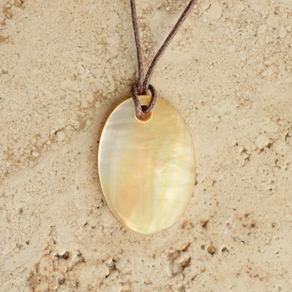 Our stunning Mother of Pearl Nacre Necklace features our Cygnet Bay grown Mother of Pearl shell carved into a oval shape, strung on a leather cord.