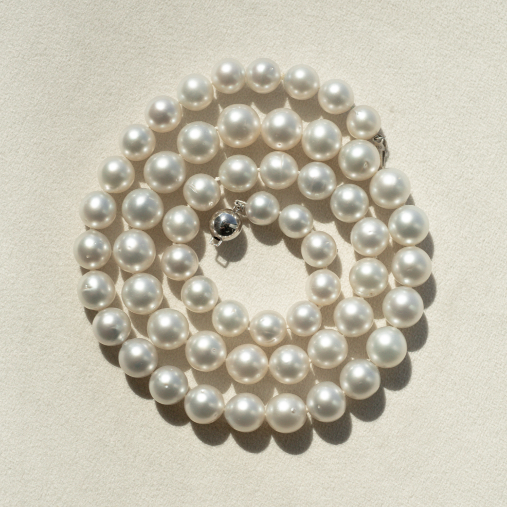 This striking Pearl Strand Necklace features fifty-seven (57) 9 to 11mm Near Round A3+ to B2 grade Cygnet Bay (WA) grown Australian South Sea pearls. This 63cm pearl strand is set with a 9ct White Gold clasp.