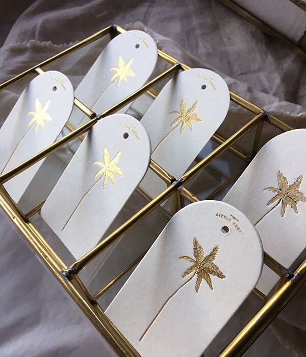 Luxury tags for gifting and decorating, in a die-cut arch shape with hole punch.

