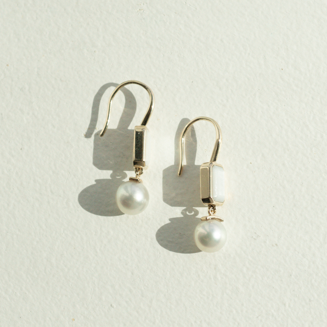 This stunning Radiance Emerald Cut &amp; Pearl Hook Earring features faceted Mother of Pearl grown at our Cygnet Bay Pearl Farm (WA) alongside a Broken Bay (NSW) grown Australian Akoya pearl.