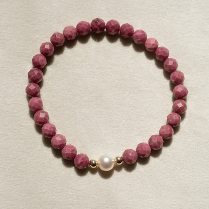 Featuring a luminous Broken Bay (NSW) grown 7mm AAA grade Australian Akoya pearl nestled alongside 28 faceted rhodonite beads and two 9ct yellow gold rondels.