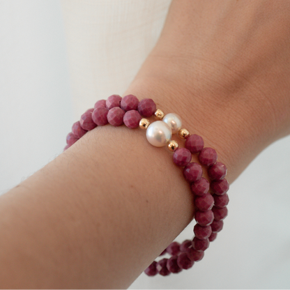 Featuring a luminous Cygnet Bay (WA) grown 8.5mm Round B1 grade Australian South Sea pearl nestled alongside 28 faceted rhodonite beads and two 9ct yellow gold rondels.