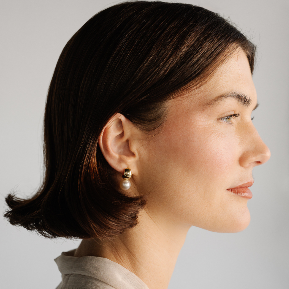 These Rounded Wide Pearl Huggie Earrings feature a pair of Cygnet Bay (WA) grown 10mm Round B2 grade Australian South Sea pearls grown at our very own Cygnet Bay Pearl Farm and set in your choice of gold plated sterling silver or sterling silver.