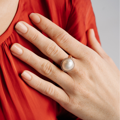 This gorgeous Save the Children Halo Pearl Ring features a Cygnet Bay (WA) grown 15mm A grade Australian South Sea Mabe pearl complemented by a halo of 38 white diamonds, set in gold.