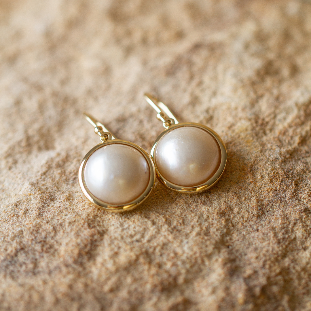 These gorgeous Save the Children Pearl Hook Earrings feature Cygnet Bay (WA) grown Australian South Sea Mabe pearls set in gold or sterling silver.