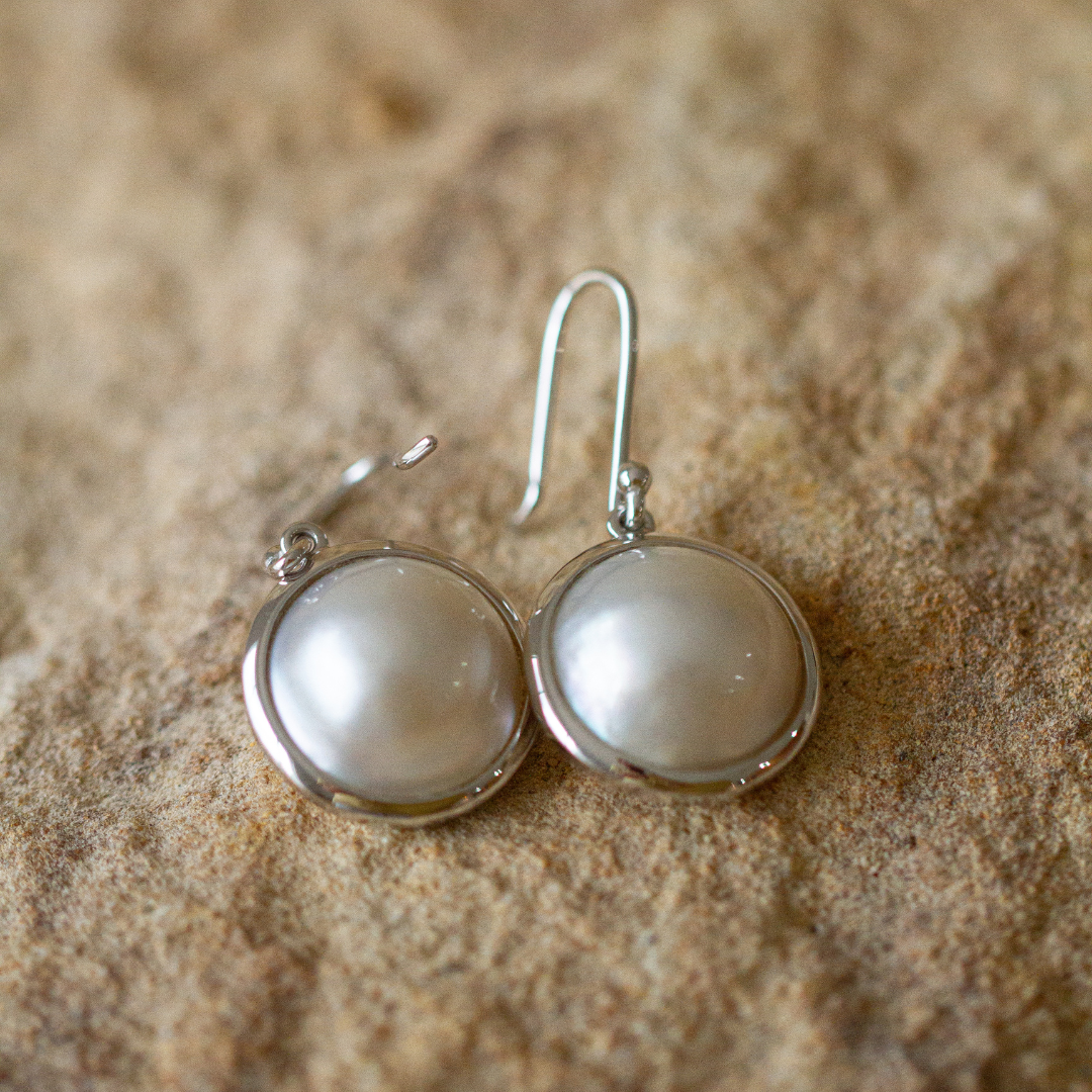 These gorgeous Save the Children Pearl Hook Earrings feature Cygnet Bay (WA) grown Australian South Sea Mabe pearls set in gold or sterling silver.