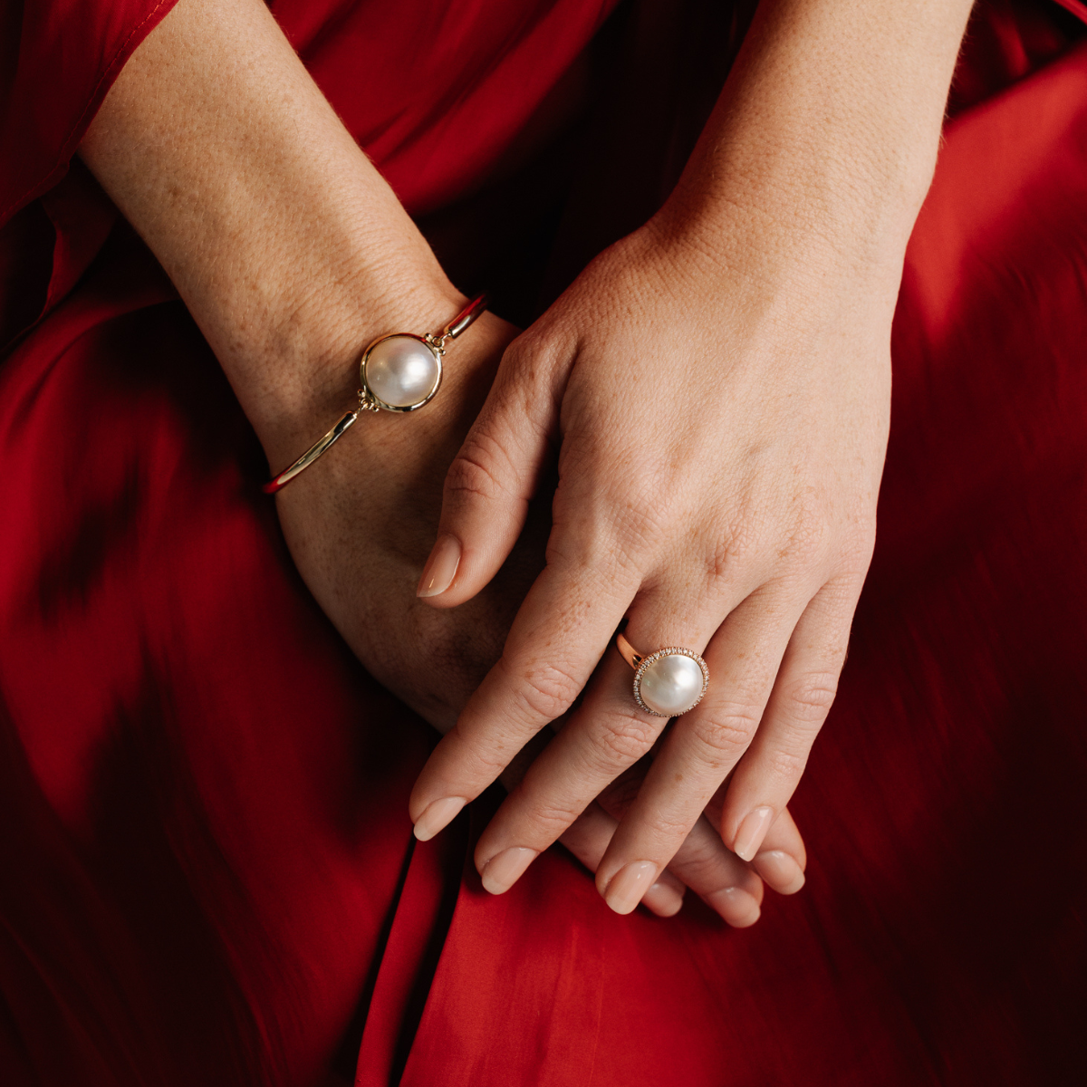 This gorgeous Save the Children Halo Pearl Ring features a Cygnet Bay (WA) grown 15mm A grade Australian South Sea Mabe pearl complemented by a halo of 38 white diamonds, set in gold.