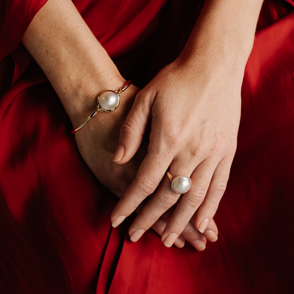 This gorgeous Save the Children Halo Pearl Ring features a Cygnet Bay (WA) grown 15mm A grade Australian South Sea Mabe pearl complemented by a halo of 38 white diamonds, set in gold.