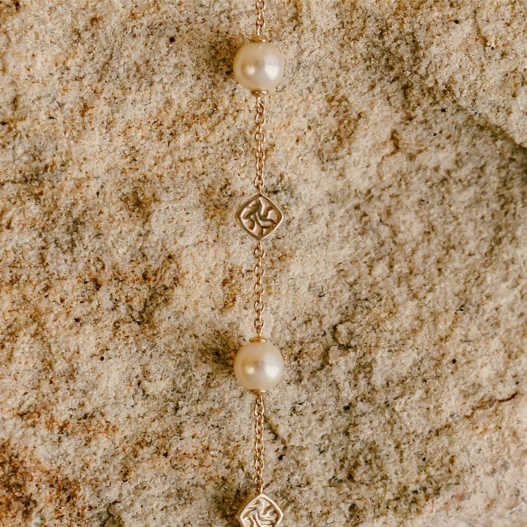 An elegant Seagrass Pearl Bracelet featuring Broken Bay (NSW) grown Australian Akoya pearls, linked together on a gold chain