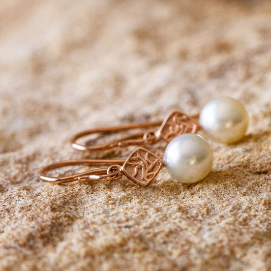 A pair of elegant Seagrass Pearl Hook Earrings feature Broken Bay (NSW) grown Australian Akoya pearls set in gold.