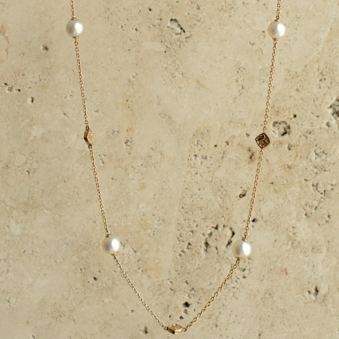 An elegant Seagrass Pearl Necklace featuring Broken Bay (NSW) grown Australian Akoya pearls set on a gold chain.