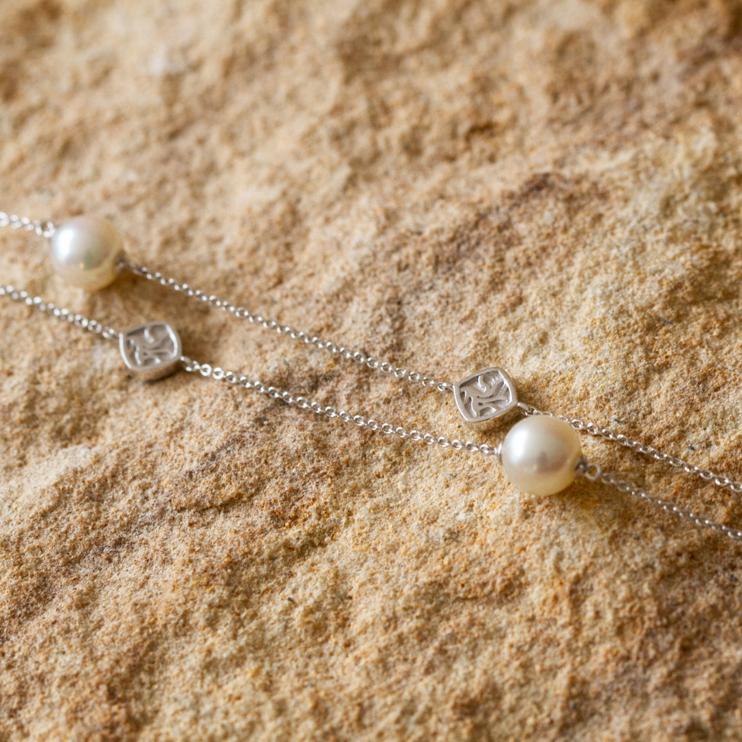 An elegant Seagrass Pearl Necklace featuring Broken Bay (NSW) grown Australian Akoya pearls set on a gold chain.