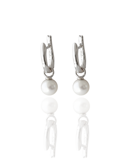 These Simple Pearl Huggie Earrings feature a pair of Broken Bay (NSW) grown 6.5mm AA grade (moderately blemished) Australian Akoya pearls set in  gold plated sterling silver.