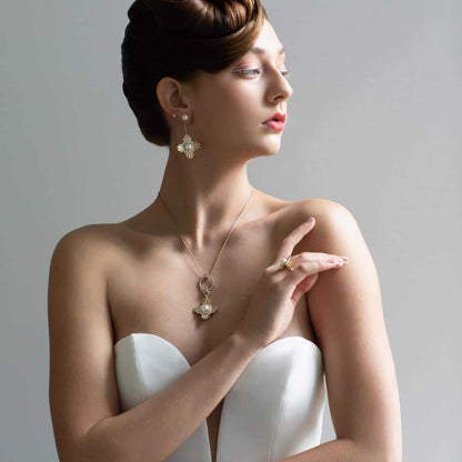 A bride wears her amazing Star of the West Pearl Pendant featuring a Cygnet Bay (WA) grown Australian South Sea pearl, complemented by 86 White Diamonds set in gold. This pendant has multi-functional components, allowing the wearer maximum versatility.