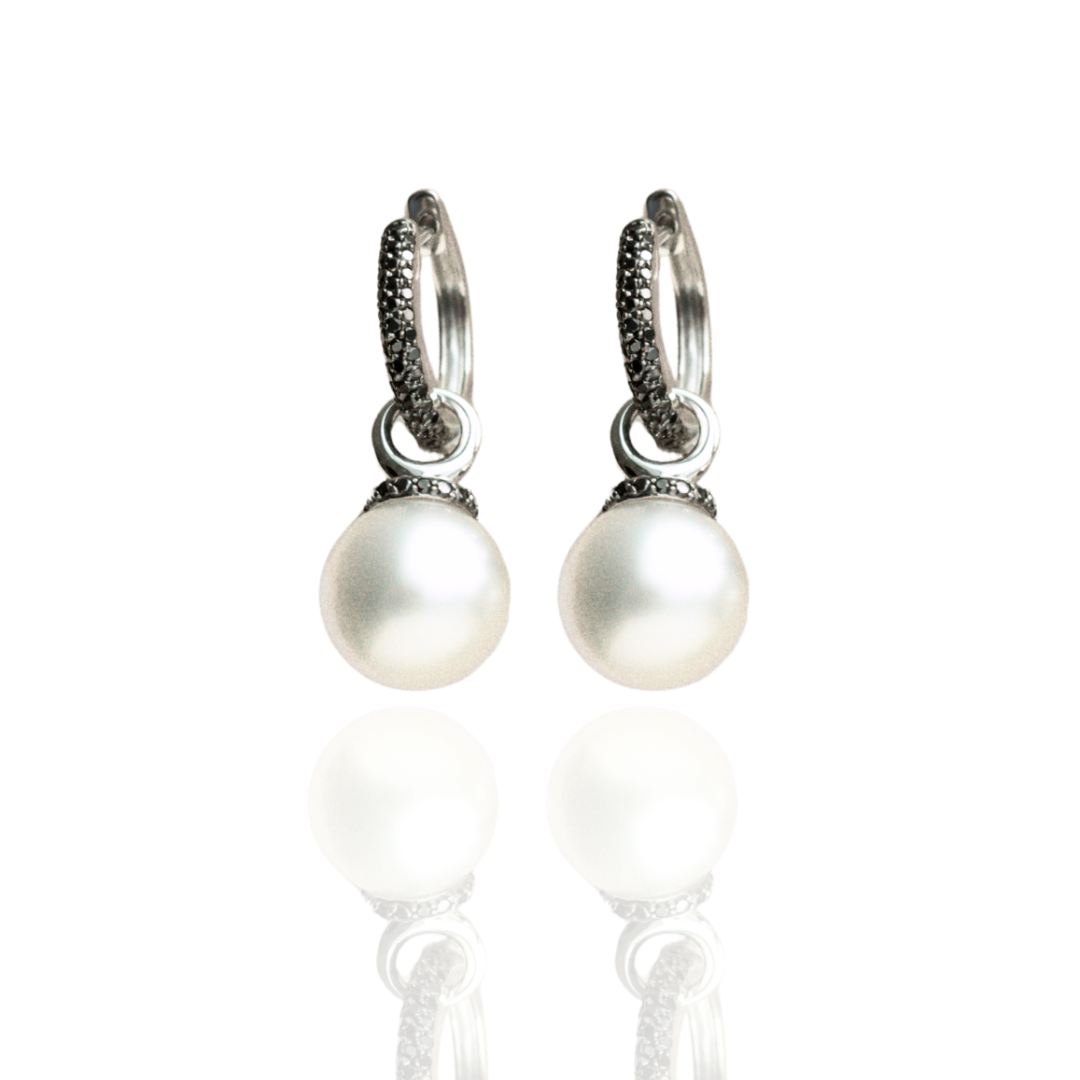 A pair of stunning Stella Petite Pearl Huggie Earrings featuring Cygnet Bay (WA) grown Australian South Sea pearls complemented by 114 Black Diamonds set in gold.