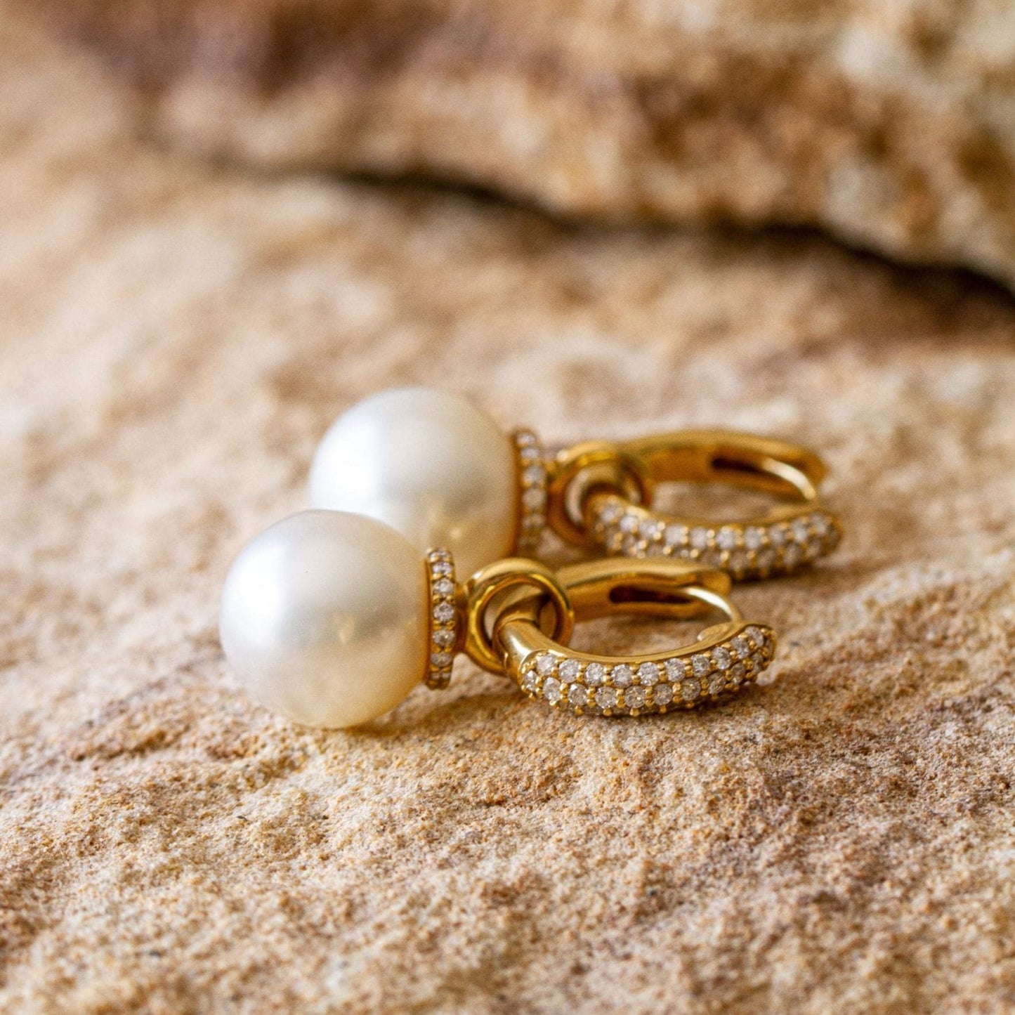 A stunning pair of Stella Pearl Huggie Earrings featuring Cygnet Bay (WA) grown Australian South Sea pearls complemented by 96 White Diamonds set in gold.