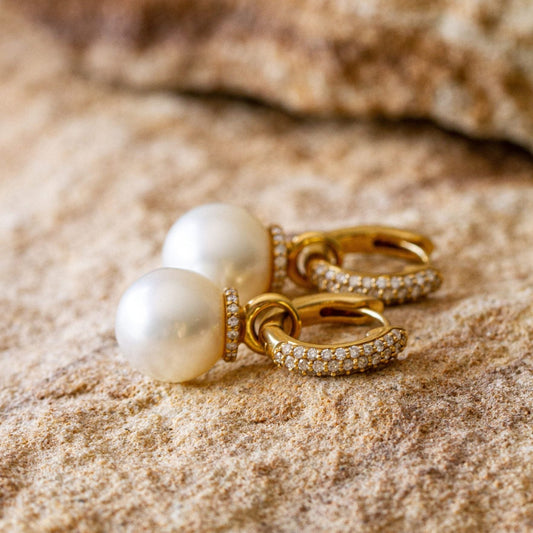 A stunning pair of Stella Pearl Huggie Earrings featuring Cygnet Bay (WA) grown Australian South Sea pearls complemented by 96 White Diamonds set in gold.