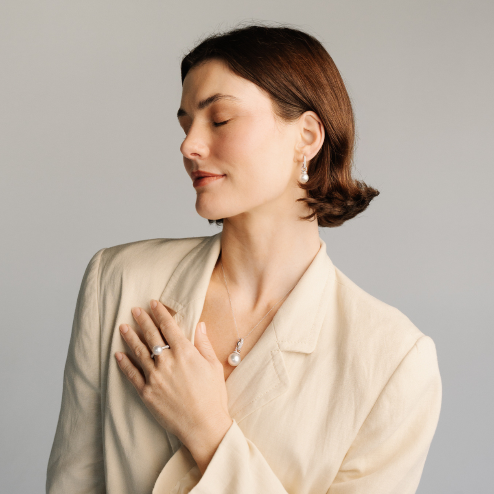 A stunning pair of Stella Pearl Huggie Earrings featuring Cygnet Bay (WA) grown 13.5mm Round A3+ grade Australian South Sea pearls complemented by 96 White Diamonds set in gold.