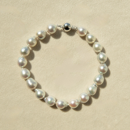 Pearl bracelet on a beige background