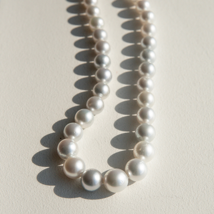 Pearl strand necklace on a light background