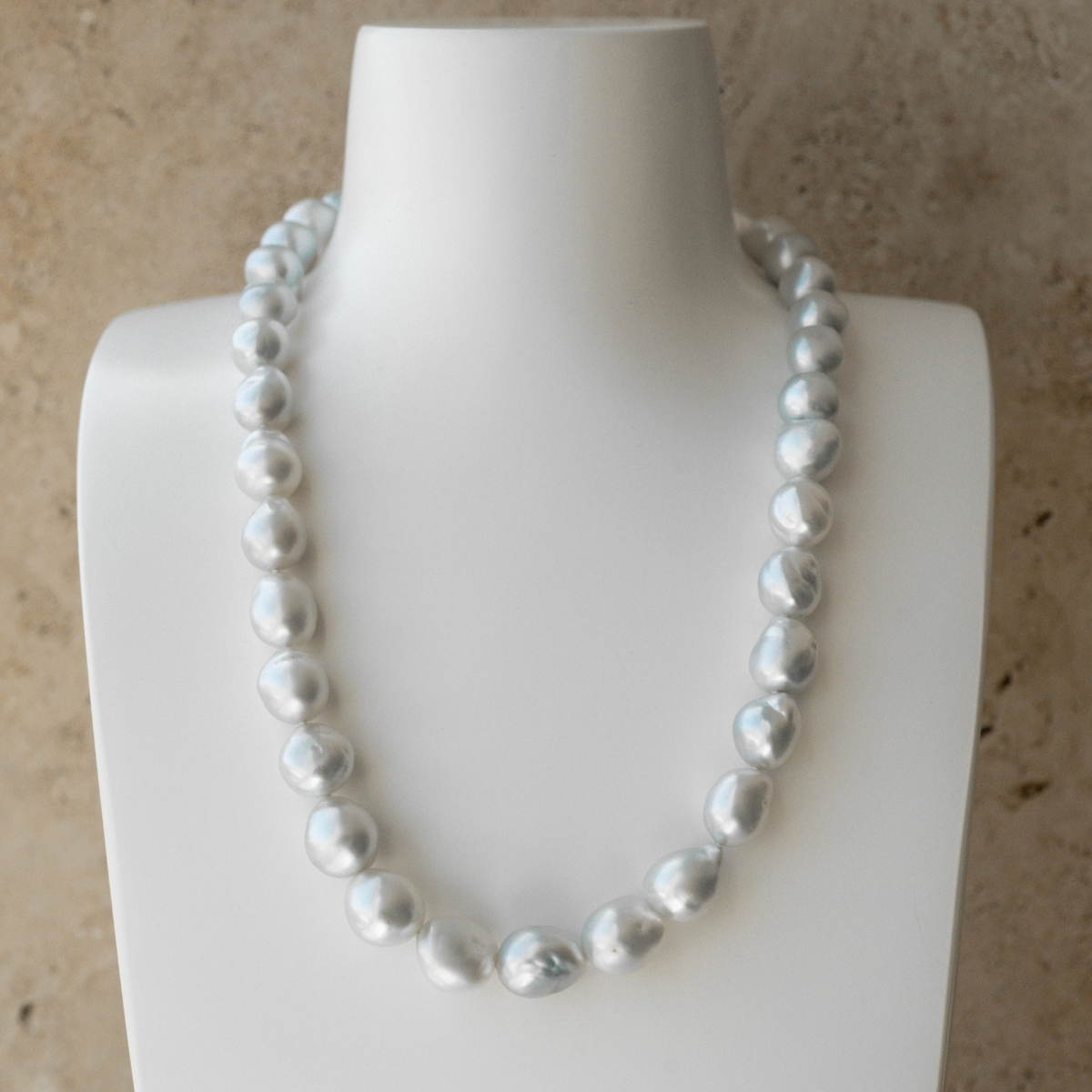 This striking Pearl Strand Necklace features thirty-five (35) 11 to 14.5mm Baroque A2+ to B1 grade Cygnet Bay (WA) grown Australian South Sea pearls. This pearl strand is set with an 18ct White Gold clasp.