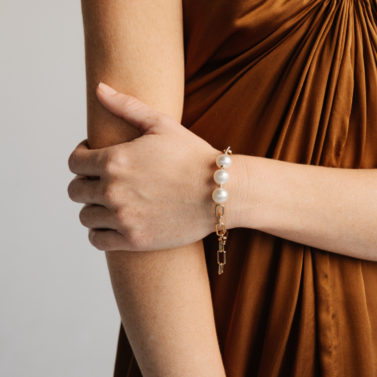 A timeless Submerge South Sea Pearl &amp; Diamond Bracelet featuring Cygnet Bay (WA) grown 11.5mm High Button A3/B1 grade Australian South Sea pearls complemented by twenty-four (24) White Diamonds (0.13ct H/SI) set on 9ct gold paperclip chain with an integrated clasp.&nbsp;