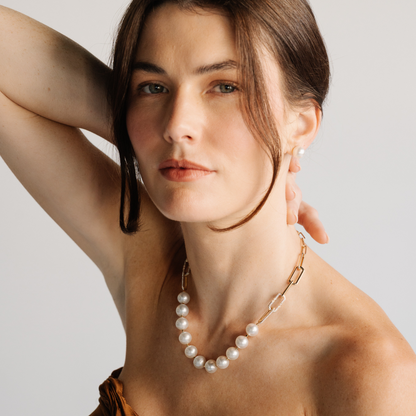 A timeless Submerge Pearl & Diamond Necklace features eleven (11) Cygnet Bay (WA) grown 11.5mm High Button B1 grade Australian South Sea pearls complemented by ninety (90) White Diamonds (0.61ct H/SI) set on 9ct gold paperclip chain with a double hinge clasp.&nbsp;