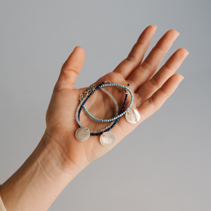 As part of our partnership with Take 3 for the Sea, we have crafted an Aquamarine charm bracelet featuring our beautiful Australian Mother of Pearl shell from our Cygnet Bay Pearl Farm. Available in two sizes, and set with an adjustable parrot clasp.