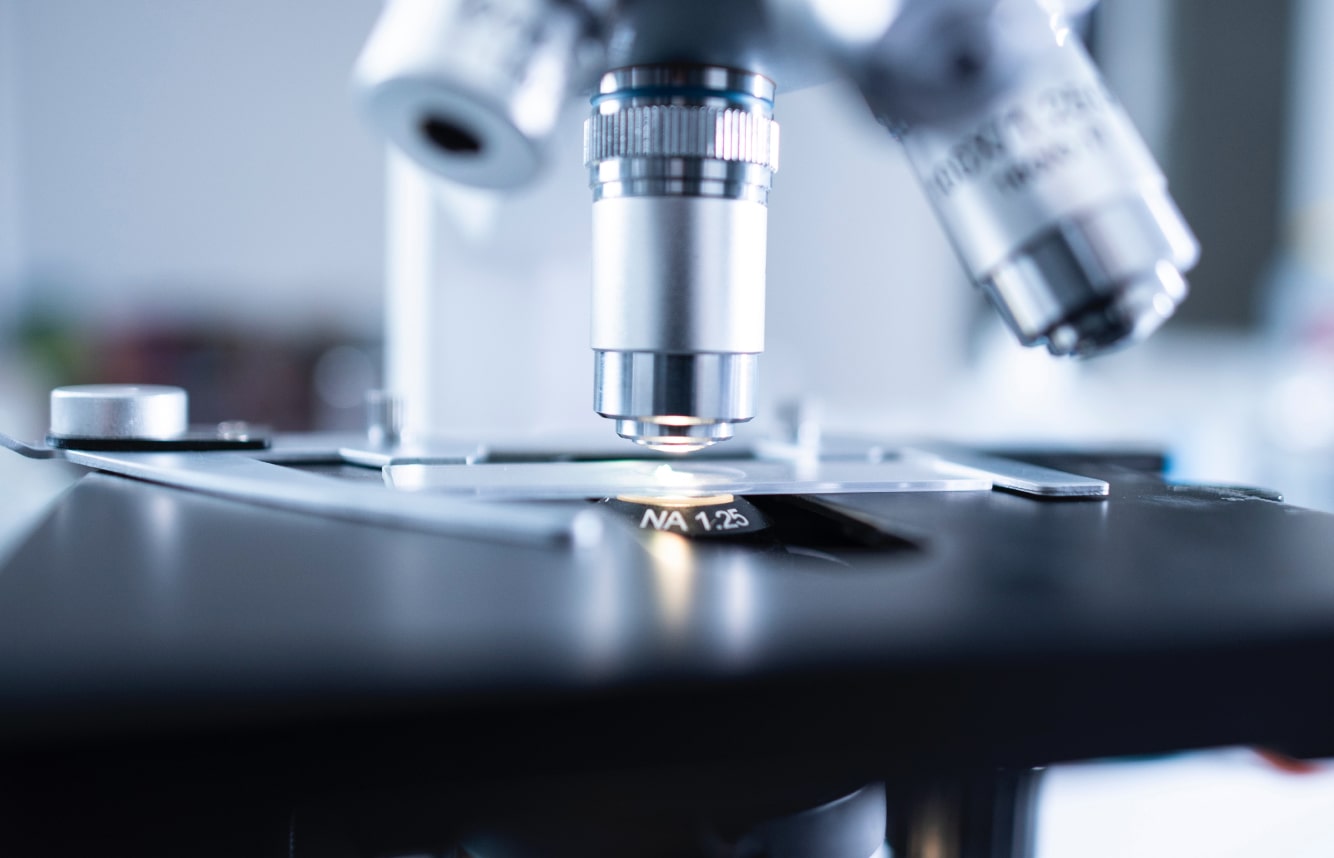 A photo of a microscope inspecting the trackability of gemstones.