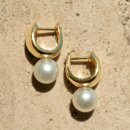 A pair of Rounded Wide Pearl Huggie Earrings featuring a pair of Broken Bay (NSW) grown 7.5mm AA grade (moderately blemished) Australian Akoya pearls grown at our very own Broken Bay Pearl Farm and set in gold plated sterling silver.