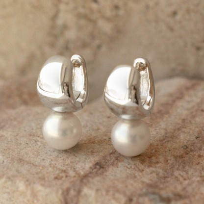 A pair of Rounded Wide Pearl Huggie Earrings featuring a pair of Broken Bay (NSW) grown 7.5mm AA grade (moderately blemished) Australian Akoya pearls grown at our very own Broken Bay Pearl Farm and set in sterling silver.