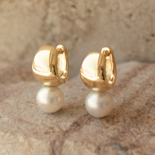 A pair of Rounded Wide Pearl Huggie Earrings featuring a pair of Broken Bay (NSW) grown 7.5mm AA grade (moderately blemished) Australian Akoya pearls grown at our very own Broken Bay Pearl Farm and set in gold plated sterling silver.