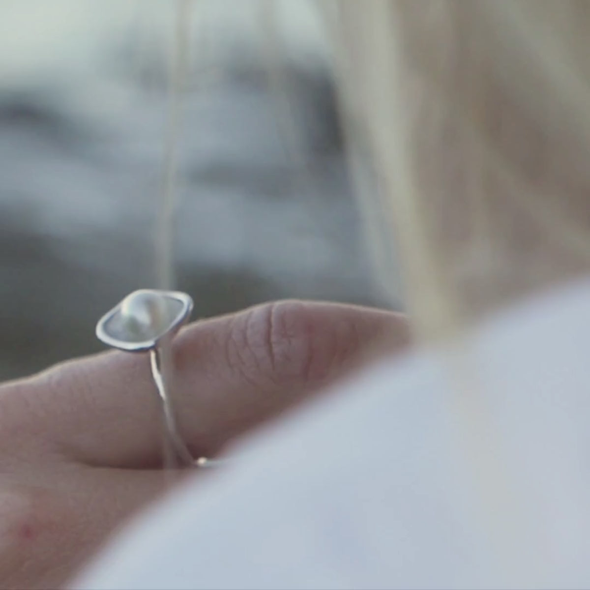 A woman wears her stunning Kimberely Lily Keshi Pearl Ring that features an organic shaped Keshi pearl grown at our Cygnet Bay Pearl Farm.