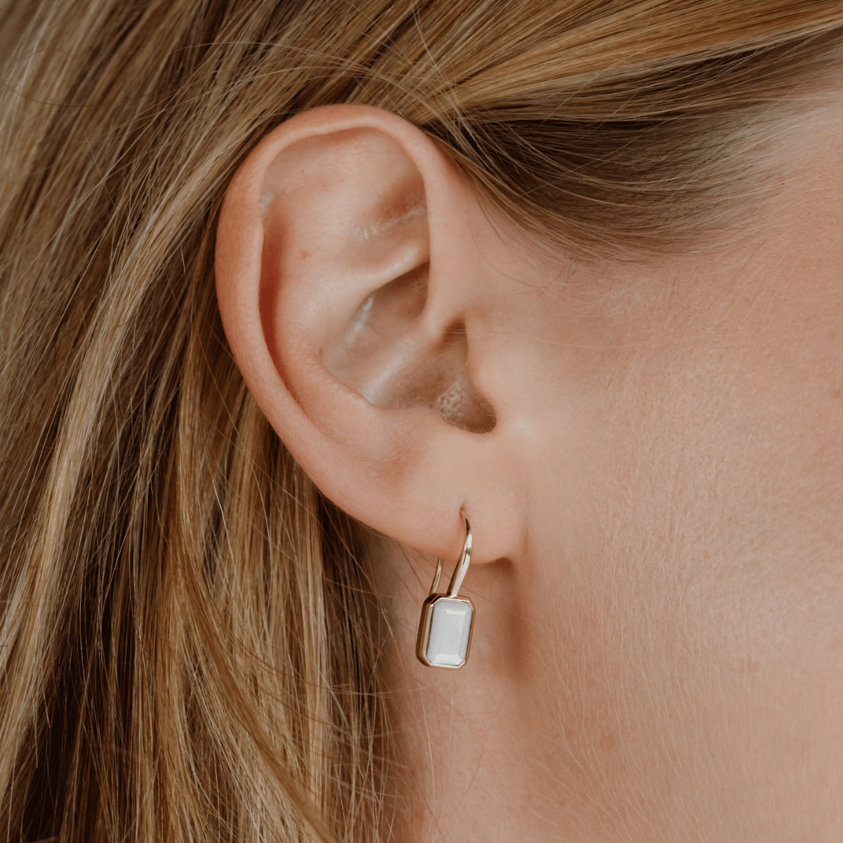 These stunning Radiance Emerald Cut Hook Earrings features faceted Mother of Pearl grown at our Cygnet Bay Pearl Farm set in gold.