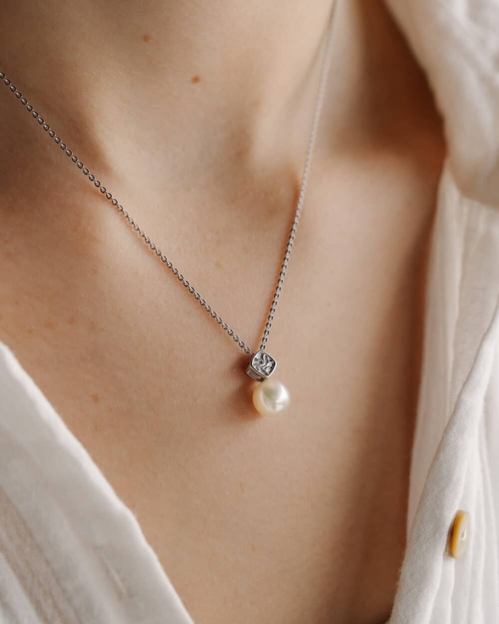 Seagrass Pendant worn by Model